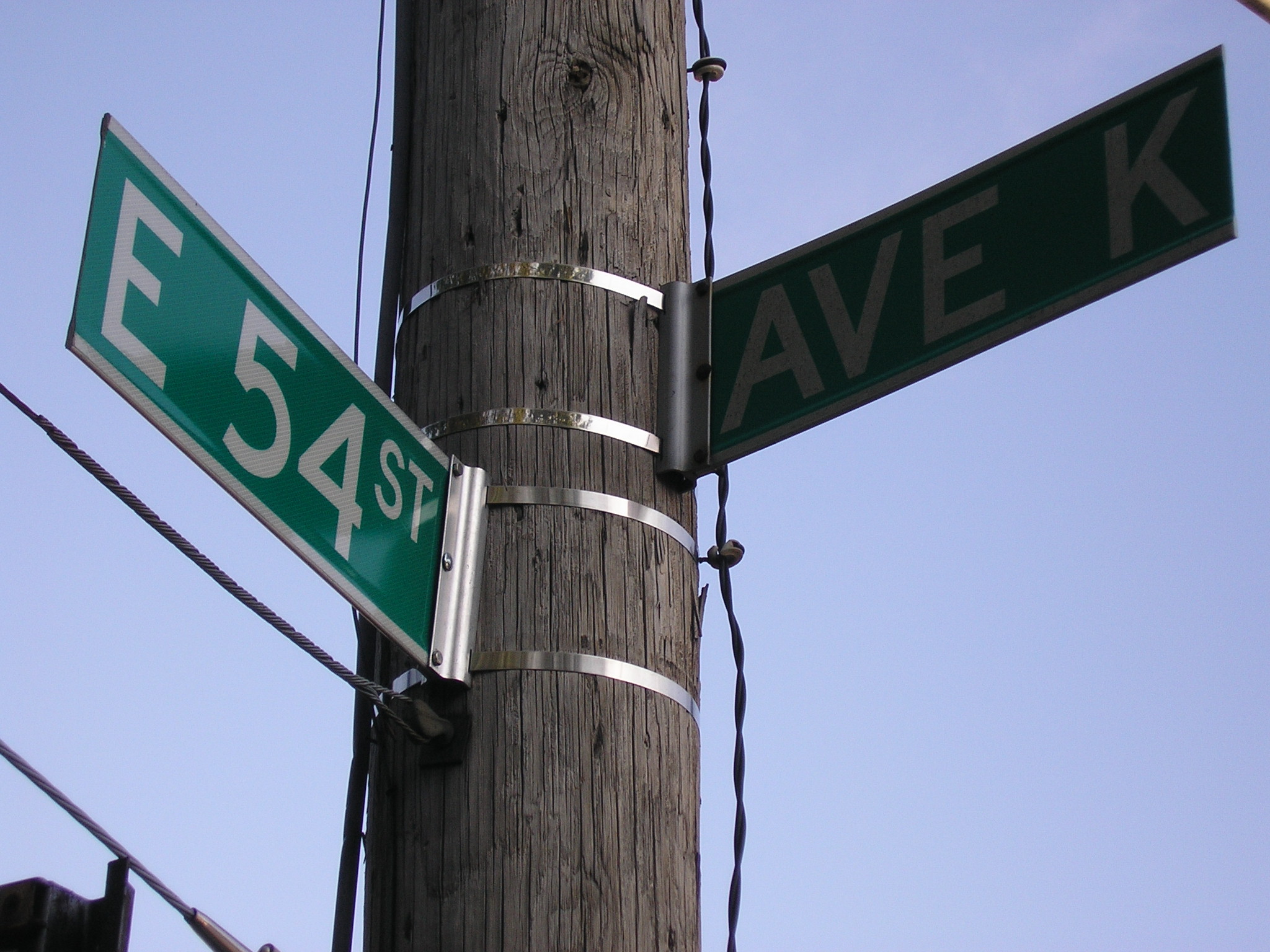 East 54th St & Avenue K street sign